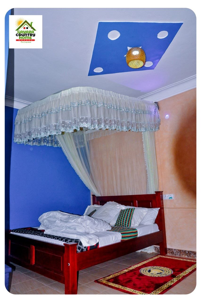 Guest room with blue ceiling and mosquito net