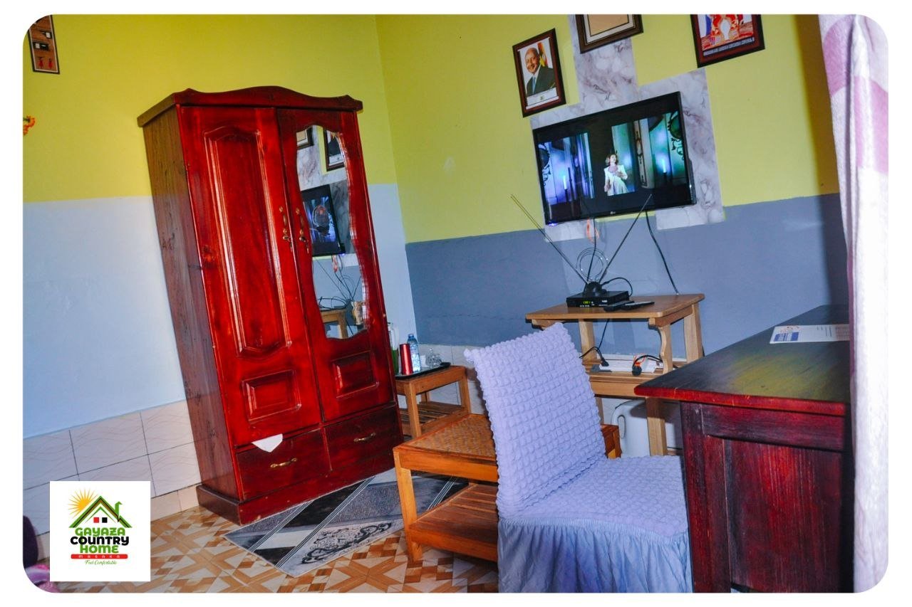Guest room with television and wardrobe