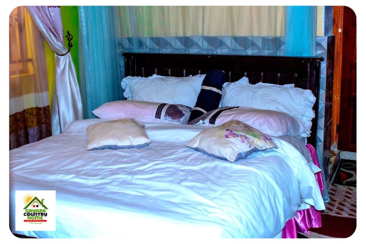 Guest bed with blue curtains
